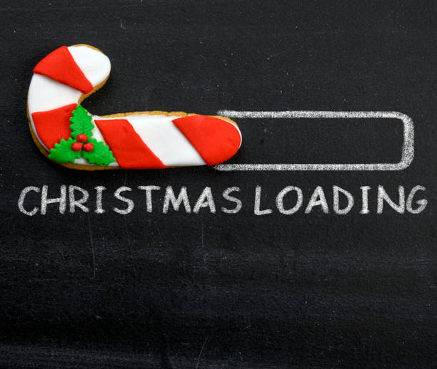 istock Blackboard Holiday Decoration - Christmas loading Candy Cane 1352844682