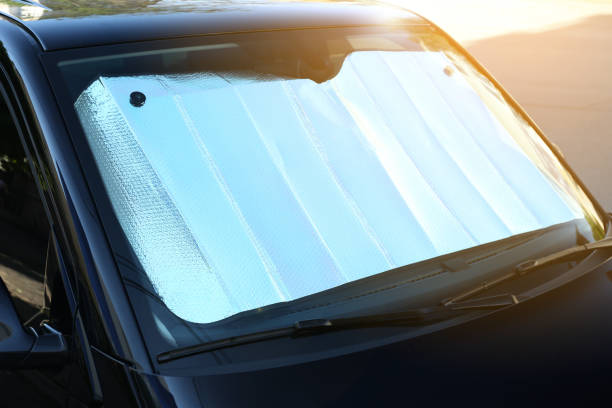 istock Sun shade under windshield inside car, closeup. Heat protection 1352846258