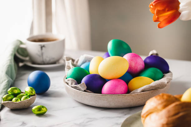 istock Colorful Easter eggs with cup of coffee on table 1352848477