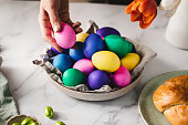 Woman decorating breakfast table for Easter