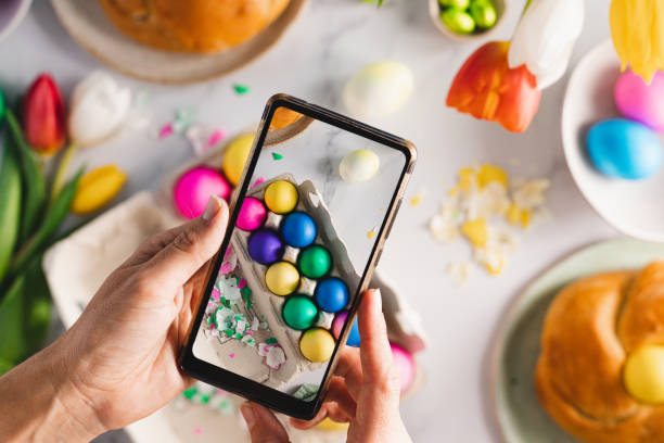 woman photographing beautifully decorated easter breakfast table - egg cell imagens e fotografias de stock