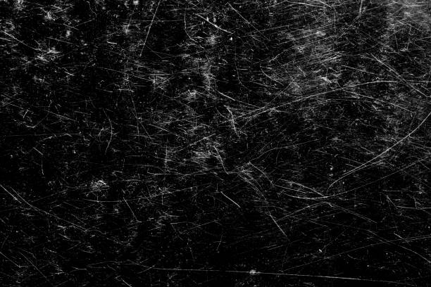 istock scratches isolated on a black background. template for design 1352848790
