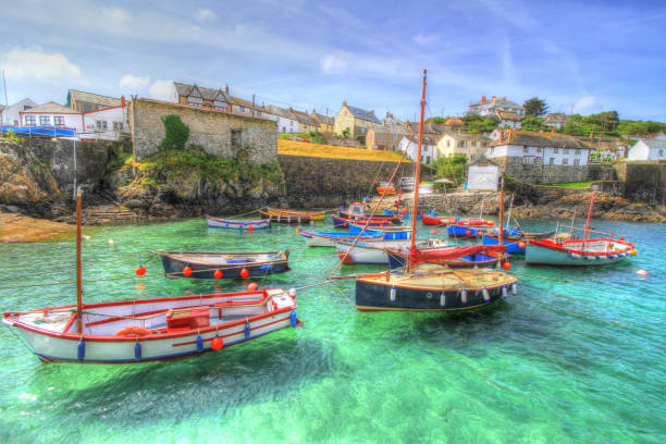 istock Coverack Cornwall fishing harbour bright blue sea 1352850719