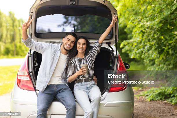 Emotional Middleeastern Couple Drinking Coffee At Country Side Stock Photo - Download Image Now