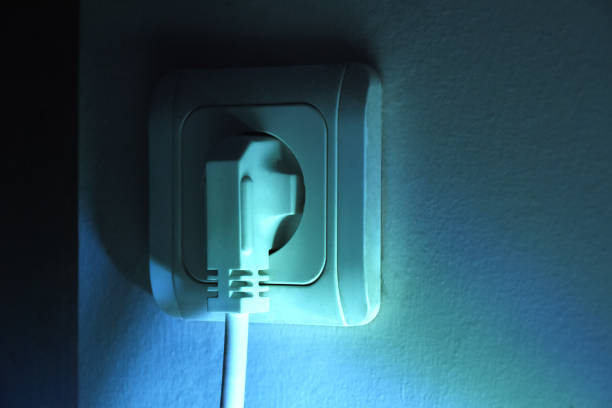 istock Electric plug in electric outlet 1352853267