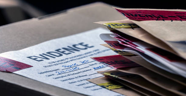 Files and evidence bag in a crime lab, conceptual image stock photo