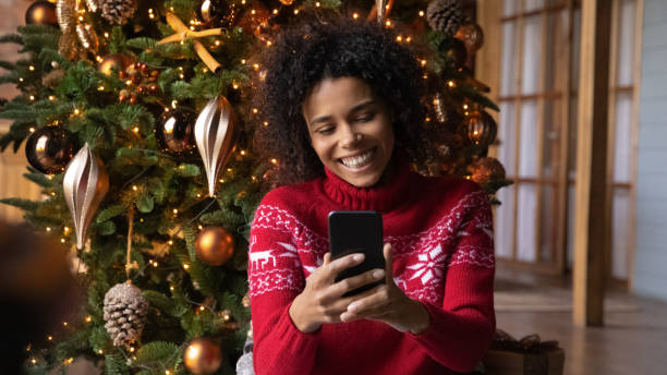istock Smiling biracial woman have pleasant video call on cell 1352853586