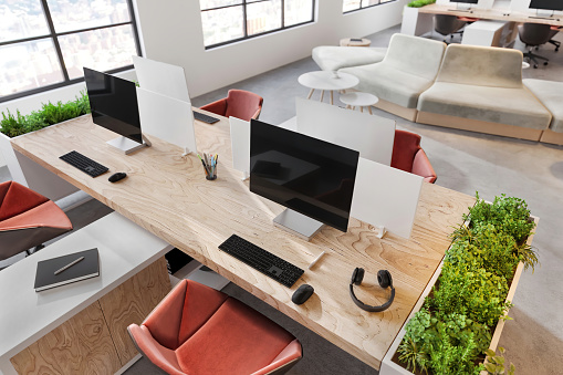 Large computer monitors on office desk. Corporate business interior. Render, copy space