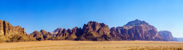 istock Panoramic view of sandstone cliffs, in Wadi Rum 1352856577