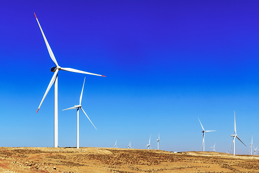 View of wind turbines along the King highway, in Southern Jordan