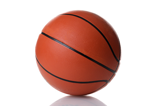Basketball ball on white reflective background. Choosing meat for game concept