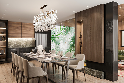 Luxury open plan apartment dining rooom interior. Dining table, chairs, pendant lamp, LED light, wooden wall, decoration, parquet and kitchen in the background. Template for copy space. Render.