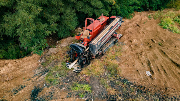 istock Horizontal directional drilling technology. Aerial view of Drilling machine work process. Trenchless laying of communications, pipes and water pipes 1352866209
