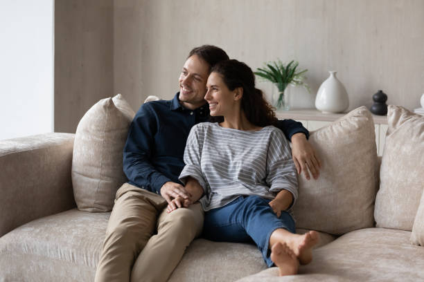 istock Relaxed smiling millennial couple enjoying leisure time. 1352867566