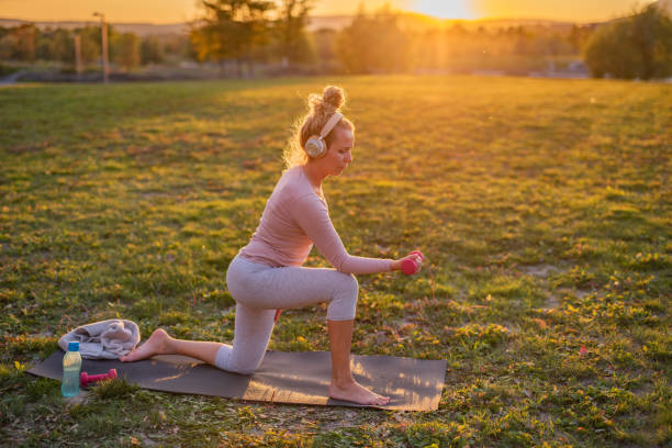 istock Woman exercising in nature 1352872839