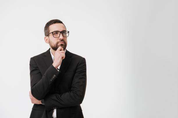 istock Handsome serious young bearded businessman 1352874611