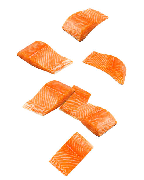 istock Falling raw salmon, fish isolated on white background, clipping path, full depth of field 1352876318