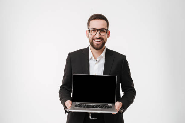 istock Cheerful businessman showing display of laptop computer. 1352876472