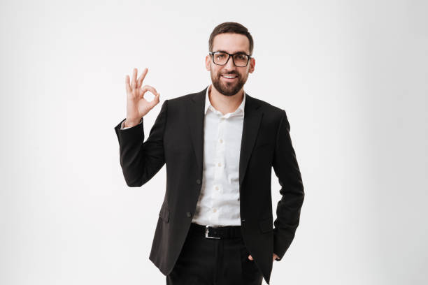 istock Attractive happy young bearded businessman make okay gesture. 1352877133