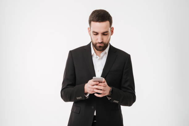 istock Handsome businessman chatting by mobile phone. 1352877280