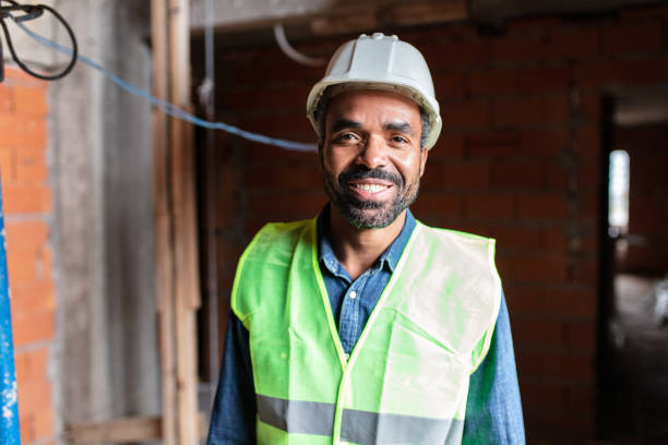 istock Portrait of confident architect standing construction site 1352878493