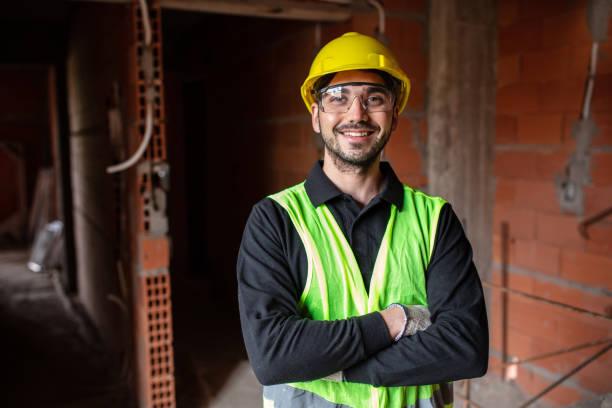 istock Portrait of a confident young man working at construction site 1352879645