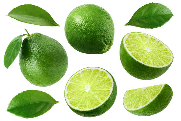 istock Fresh limes with leaves isolated on white background, collection 1352880346