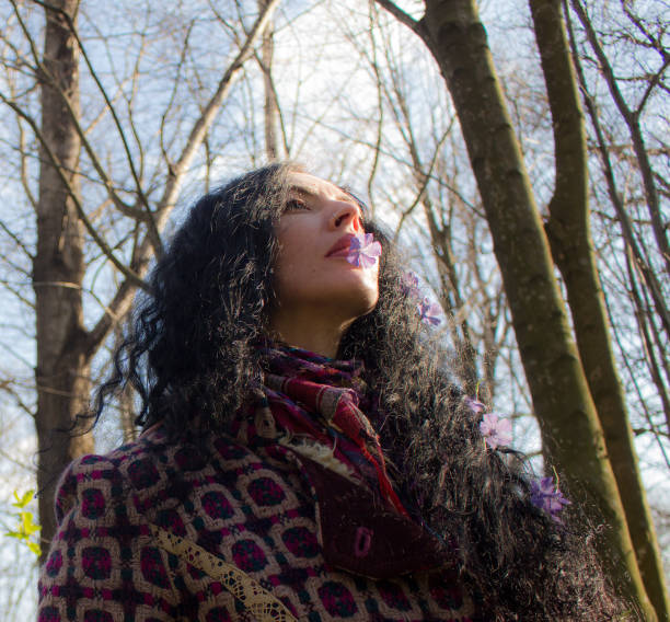 girl with dark hair in the spring forest
