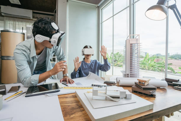 Team Architect or Engineer designer wearing VR headset for BIM technology working together design 3D model building in office.