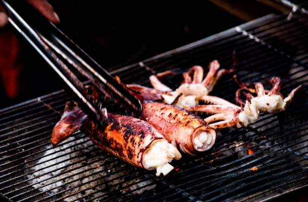 Charcoal grilled egg squid for sale on the beach in Won Bangsaen, Thailand