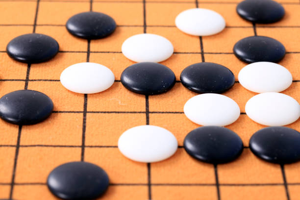 istock chinese game go,  Gobang and go game board 1352882723