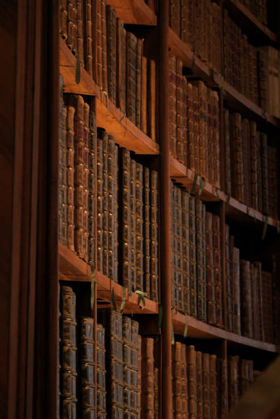 istock Old books on curve bookshelf 1352884071