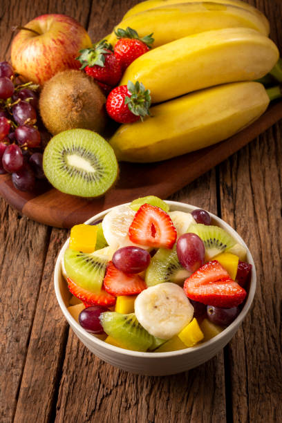 istock Fruit salad in bowl on the table. 1352885262