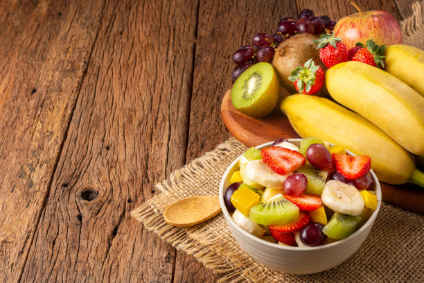 istock Fruit salad in bowl on the table. 1352885515
