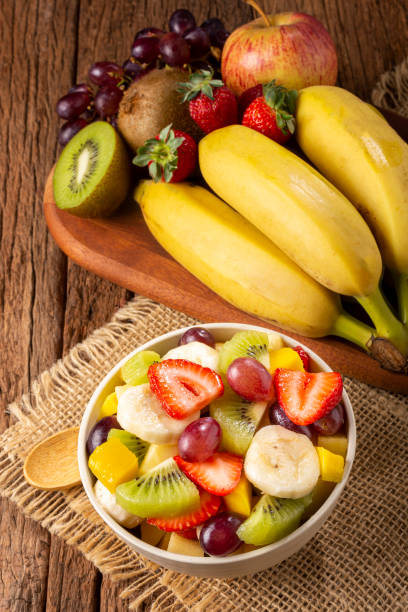 istock Fruit salad in bowl on the table. 1352885516