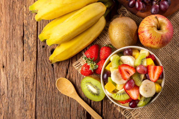istock Fruit salad in bowl on the table. 1352885769