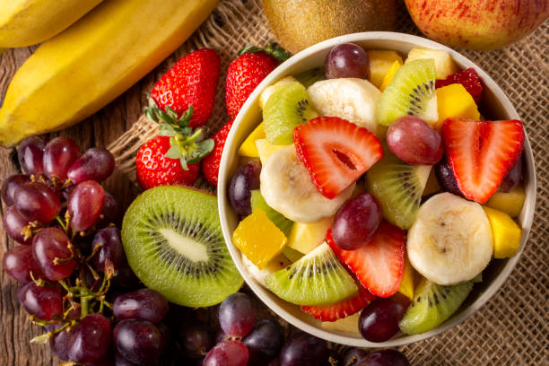 istock Fruit salad in bowl on the table. 1352885788
