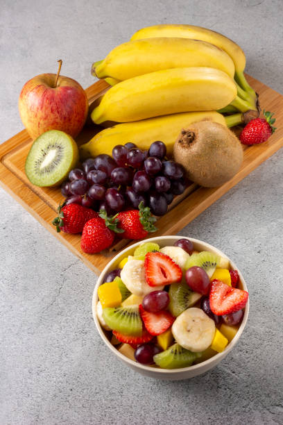 istock Fruit salad in bowl on the table. 1352885959