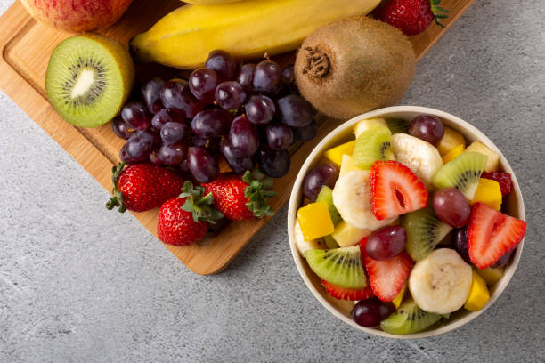 istock Fruit salad in bowl on the table. 1352886687