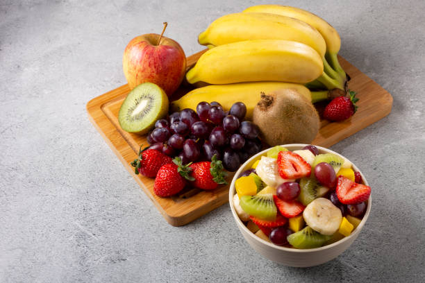 istock Fruit salad in bowl on the table. 1352886694