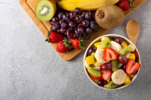 istock Fruit salad in bowl on the table. 1352886763