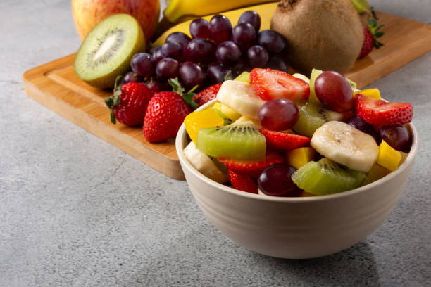istock Fruit salad in bowl on the table. 1352887385