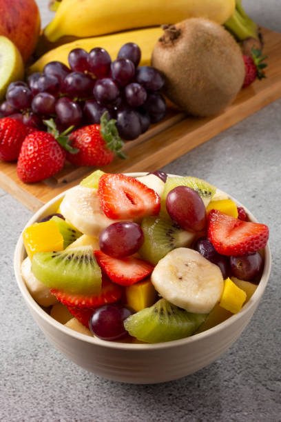 istock Fruit salad in bowl on the table. 1352887529