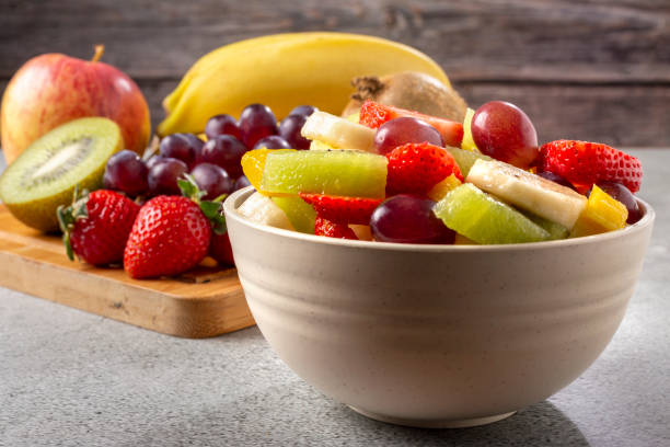 istock Fruit salad in bowl on the table. 1352887531