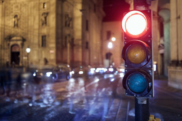 istock Red light on traffic lights against crosswalk 1352887610