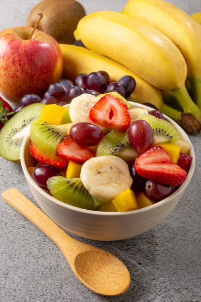 istock Fruit salad in bowl on the table. 1352887758
