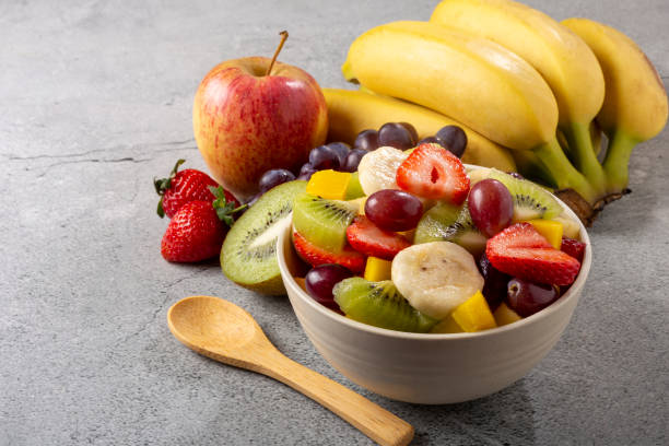 istock Fruit salad in bowl on the table. 1352887759