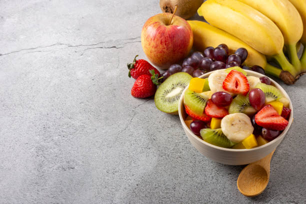 istock Fruit salad in bowl on the table. 1352887761