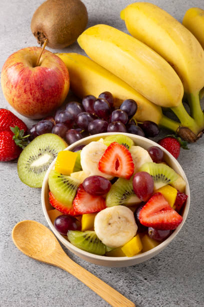 istock Fruit salad in bowl on the table. 1352887794