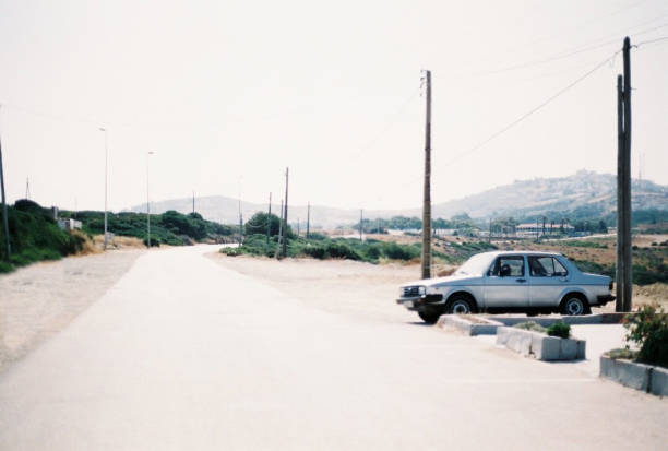 istock Blue Car Next to a Road in Rural Morocco 1352888027